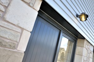 close up of front door with natural stone walls